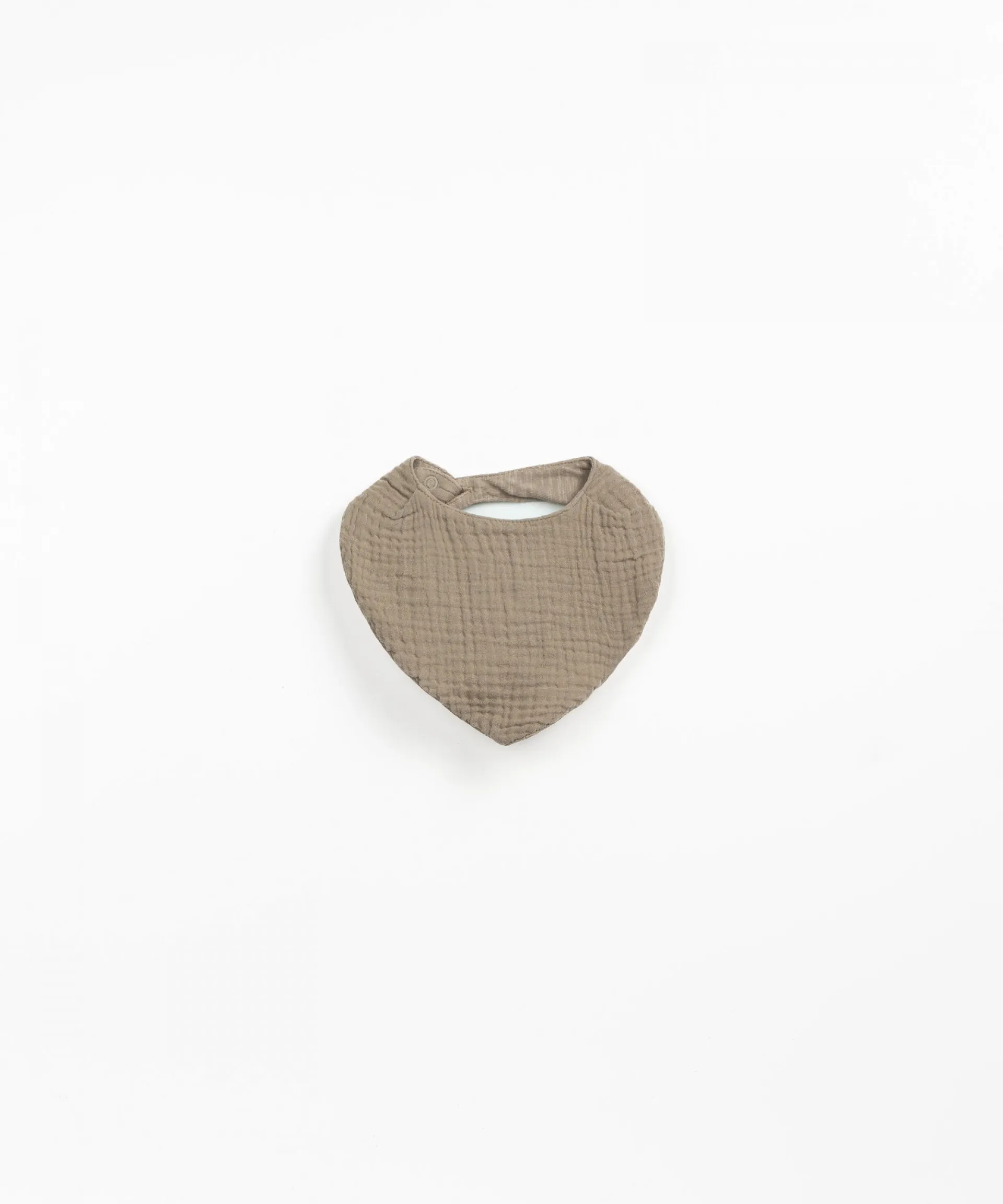 Babero con cierre de corchete | Textile Art