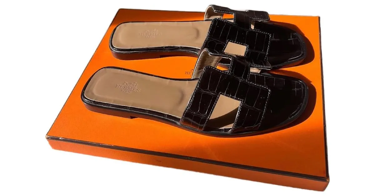 Oran Hermès Sandalias abiertas Negro 