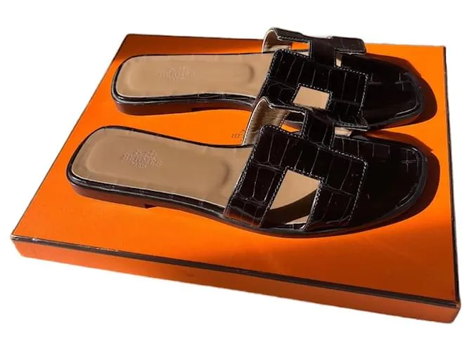 Oran Hermès Sandalias abiertas Negro 