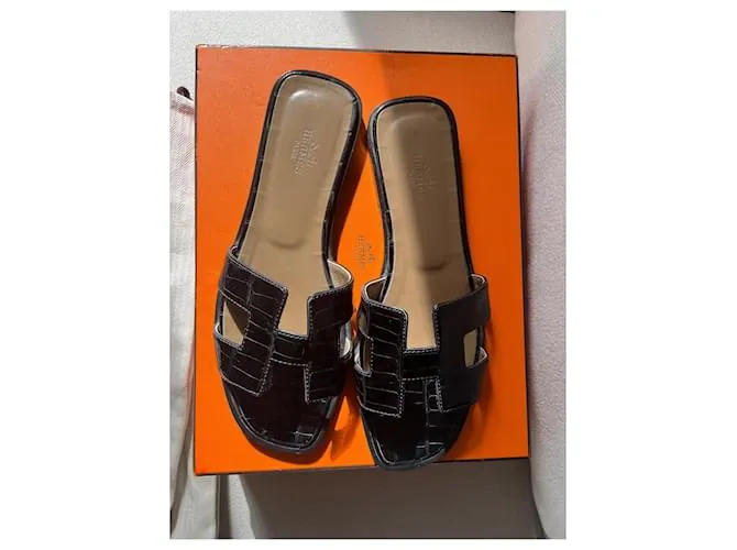 Oran Hermès Sandalias abiertas Negro 