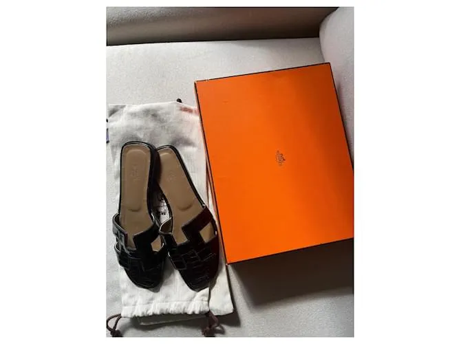 Oran Hermès Sandalias abiertas Negro 