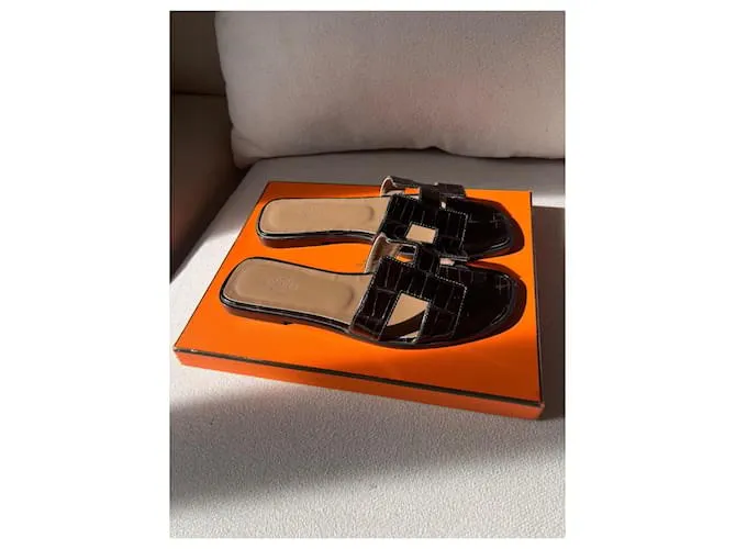 Oran Hermès Sandalias abiertas Negro 