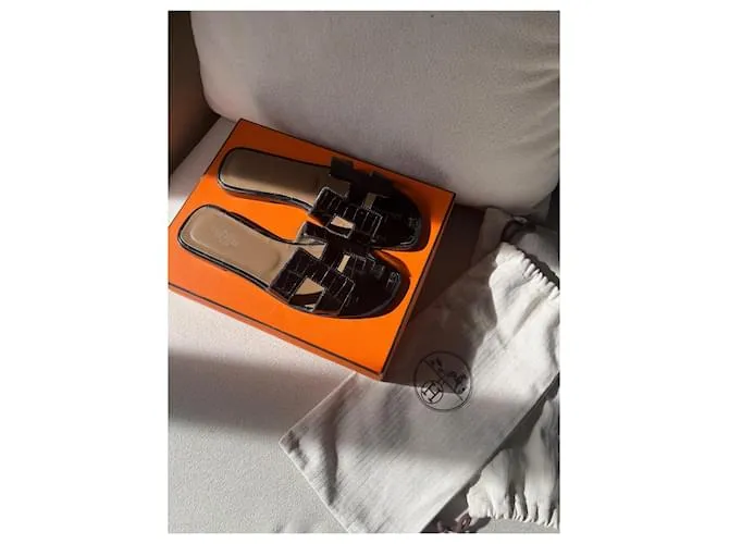 Oran Hermès Sandalias abiertas Negro 