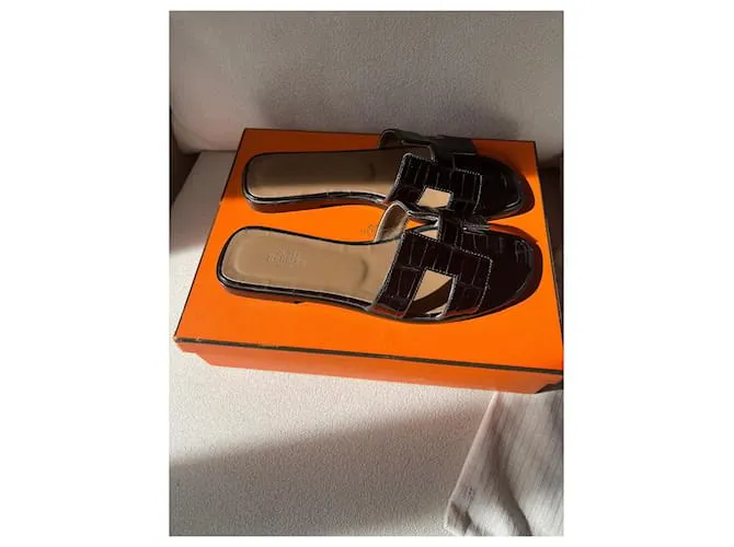 Oran Hermès Sandalias abiertas Negro 