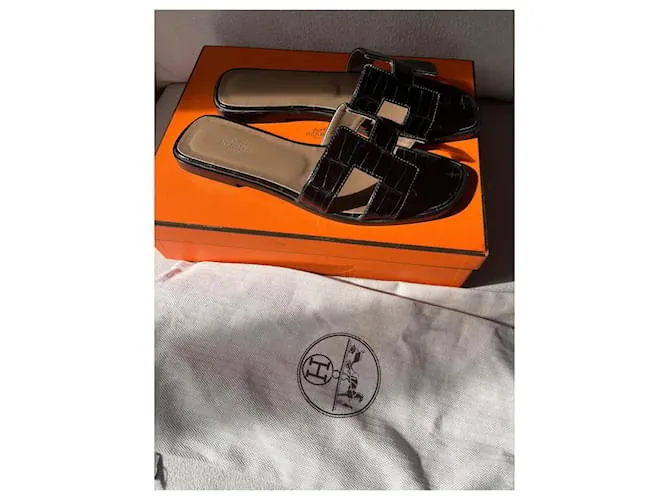 Oran Hermès Sandalias abiertas Negro 