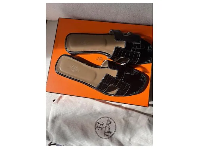 Oran Hermès Sandalias abiertas Negro 