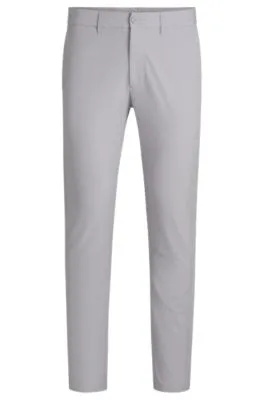 Pantalones slim fit en tejido elástico repelente al agua