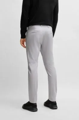 Pantalones slim fit en tejido elástico repelente al agua