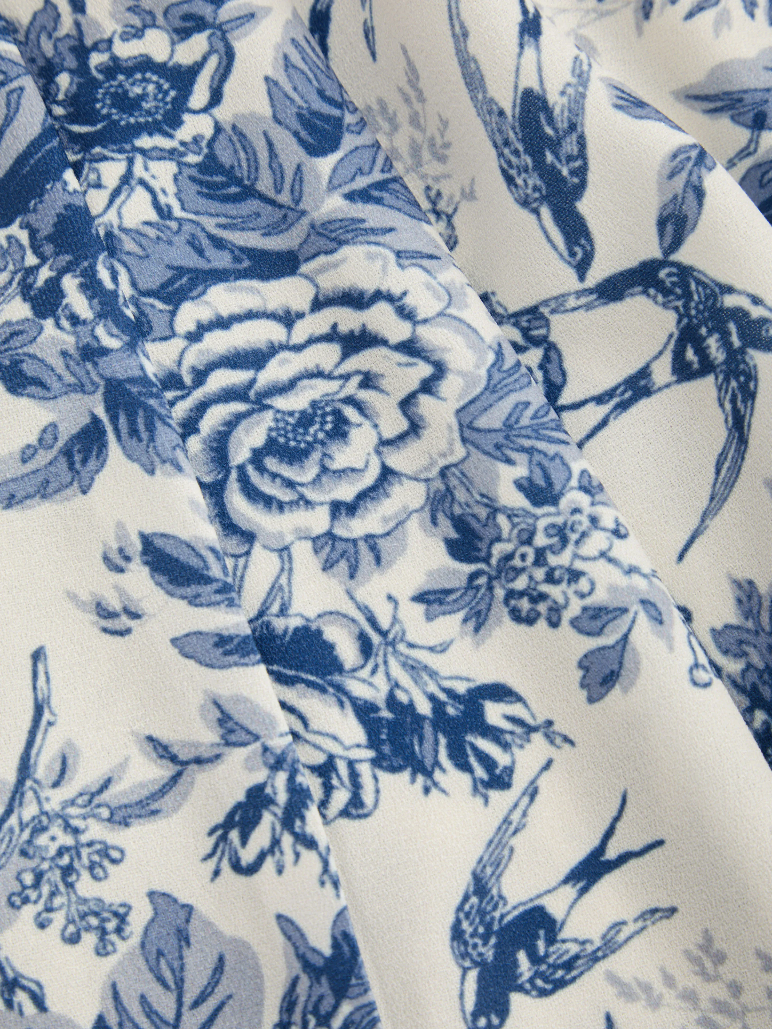 Pantalón ancho de talle alto con bolsillos y estampado floral