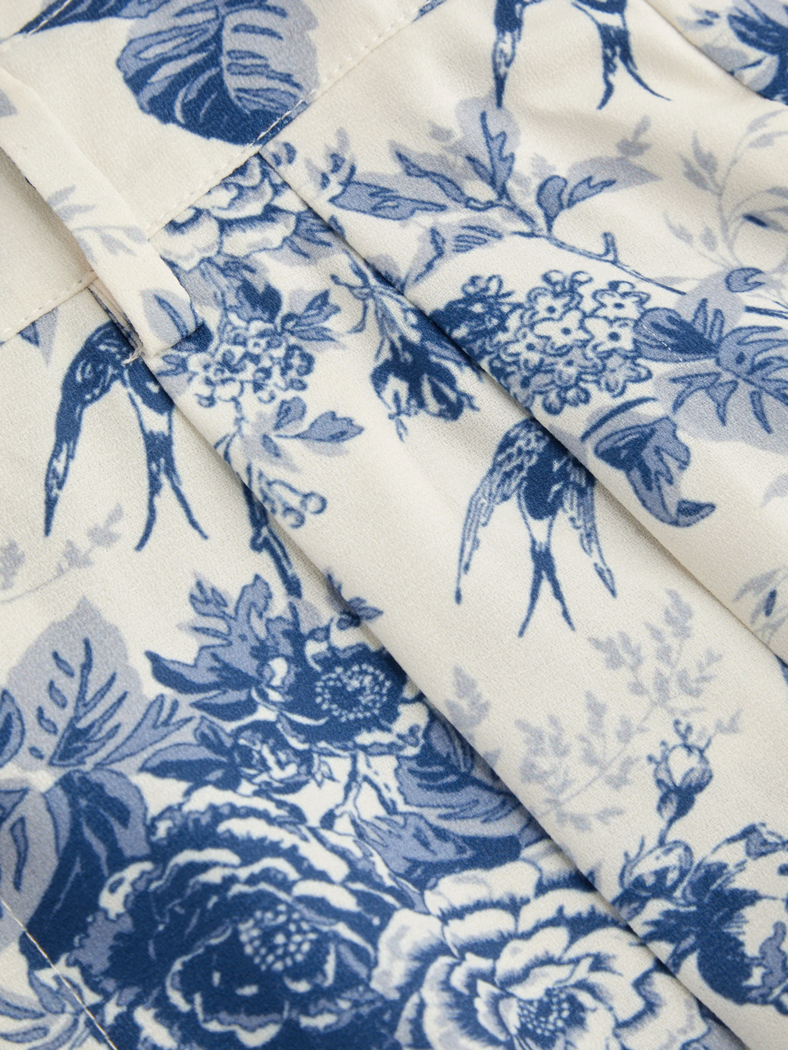 Pantalón ancho de talle alto con bolsillos y estampado floral