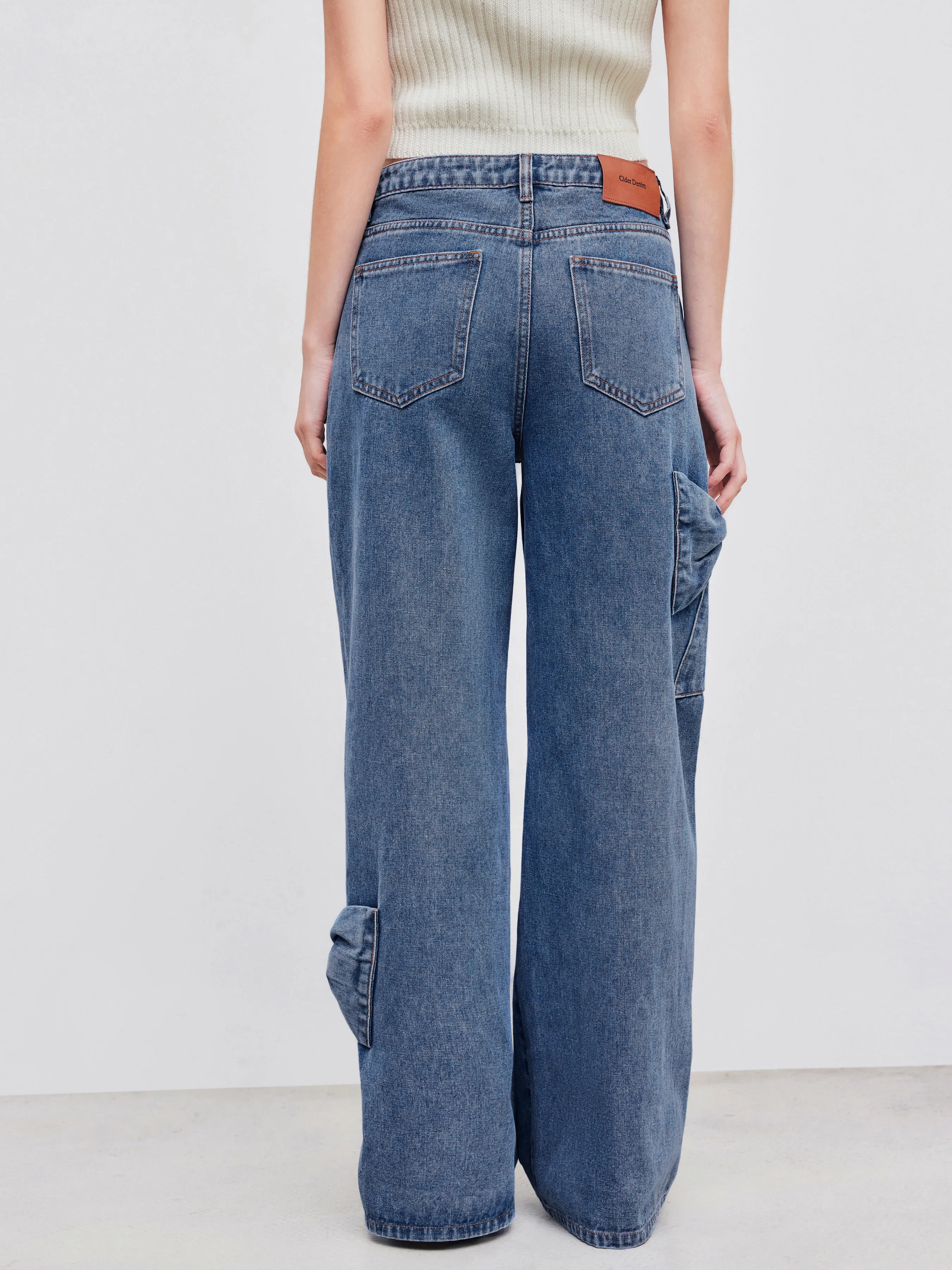 Vaqueros denim de tiro bajo con lazo y pata ancha