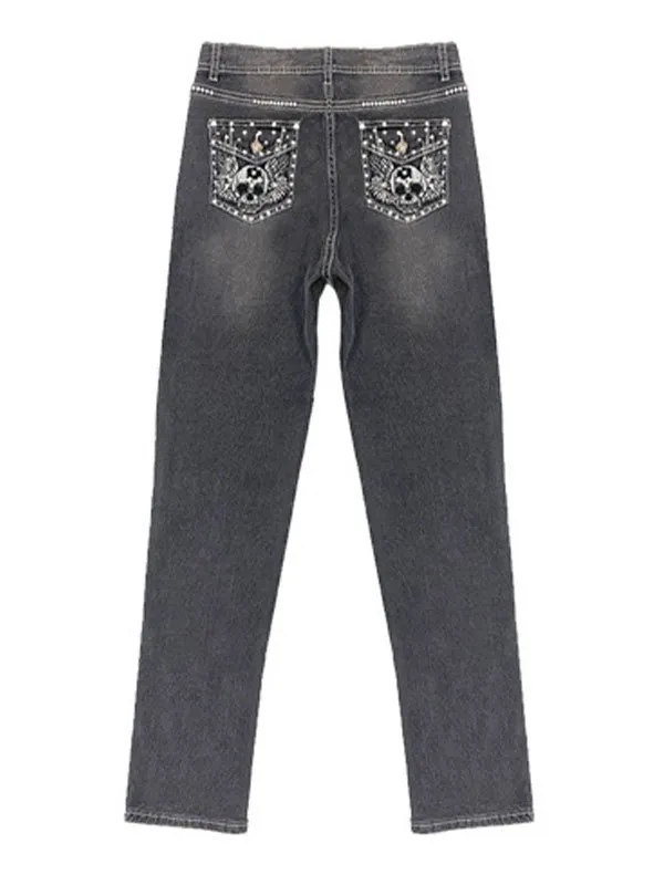 Vaqueros slim con bordado de alas de calavera