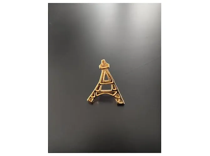 Yves Saint Laurent Alfileres y broches Dorado 