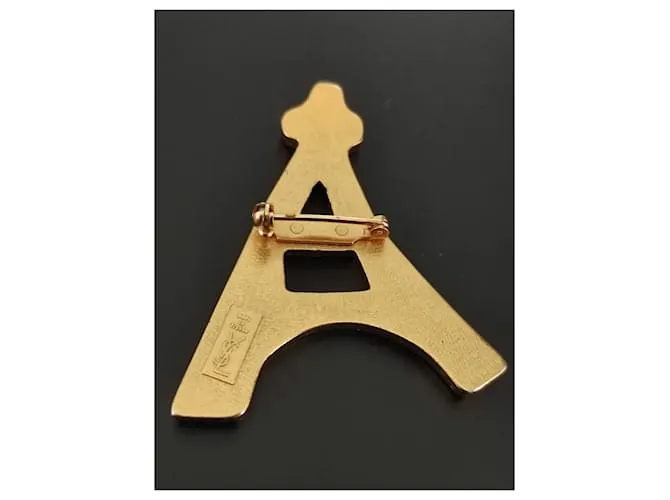 Yves Saint Laurent Alfileres y broches Dorado 