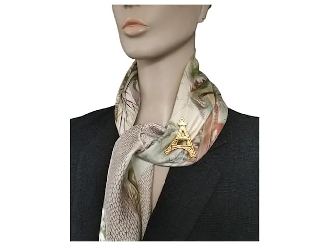Yves Saint Laurent Alfileres y broches Dorado 